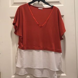 White and orange high low color block shirt